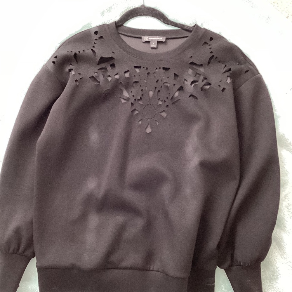 INC dressy sweatshirt with cutout neckline.